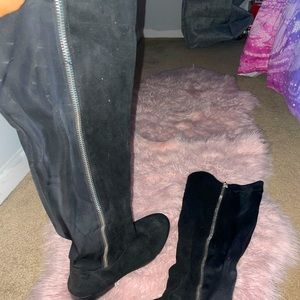 Thigh high stretch black boots with fake zipper on the side ! Great for big legs